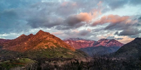 View of mountain range against cloudy sky