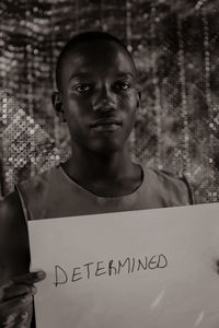 Portrait of teenage boy with text