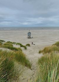 Scenic view of beach against sky