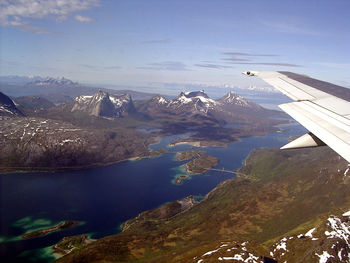 Aerial view of landscape and mountains against sky