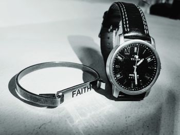 High angle view of clock on table