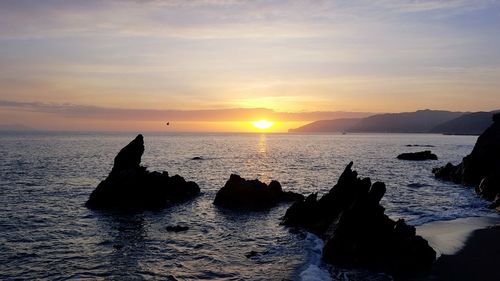 Scenic view of sea against sky during sunset