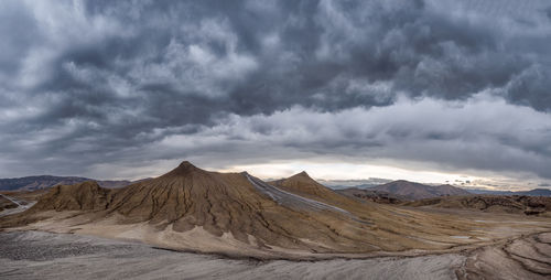 Panoramic view of volcanic mountain range against sky