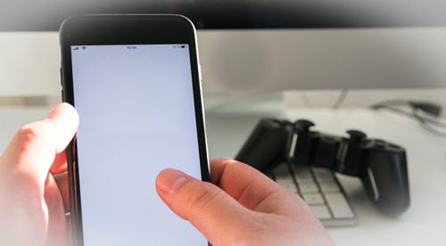Close-up of hand holding smart phone
