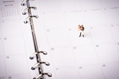 High angle view of people walking on tiled floor