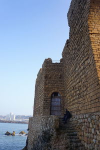 Low angle view of historic building against clear sky