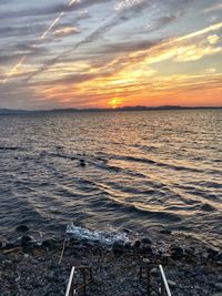 Scenic view of sea against sky during sunset