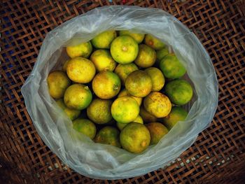 High angle view of fruits in basket on table