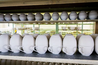 Row of various containers in shelf