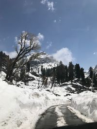 Scenic view of snow covered mountain against sky