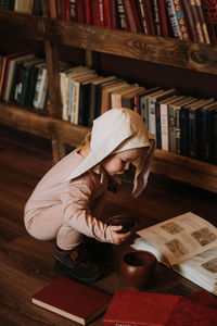 Boy sitting on book