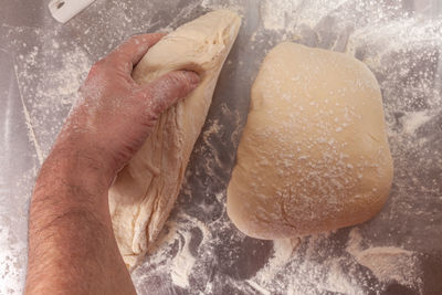 Close-up of person preparing bread