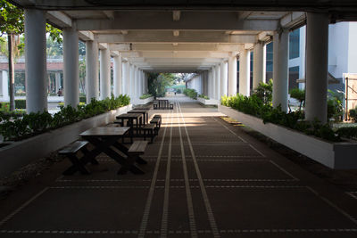 View of empty benches on bridge