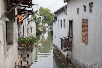 Canal amidst buildings in city