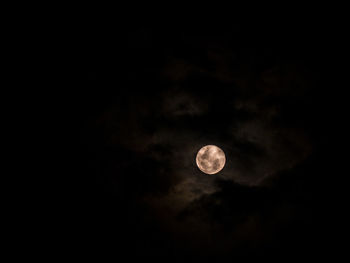 Low angle view of moon against sky at night