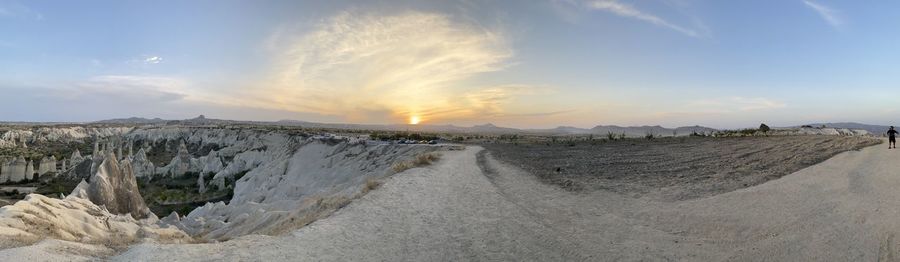 Panoramic view of land against sky during sunset