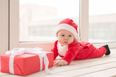 Portrait of cute baby girl at home