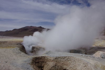 Smoke emitting from volcanic mountain