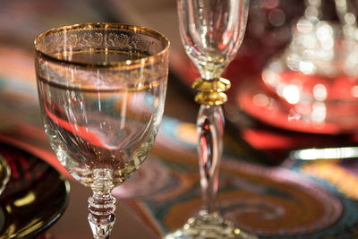 Close-up of wine glasses on table