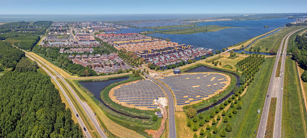 High angle view of cityscape by sea