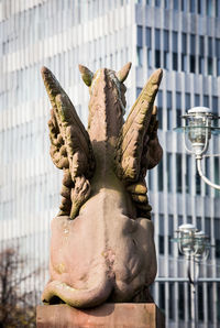 Close-up of statue against building