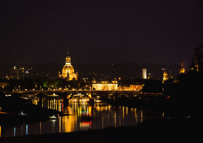Illuminated buildings in city at night