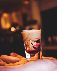 Close-up of hand holding drink