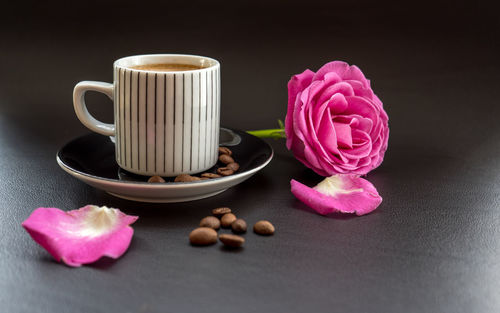 Close-up of pink roses on table