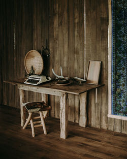 Table and chair on hardwood floor in a vintage setting