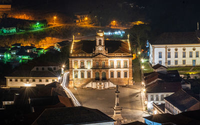 High angle view of illuminated street and buildings at night