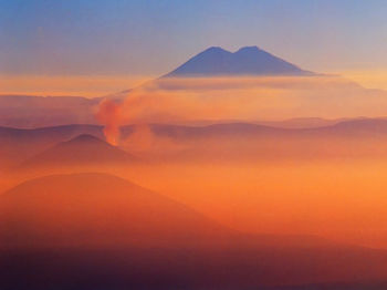 Scenic view of mountains against sky during sunset