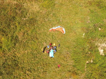 High angle view of people walking on field