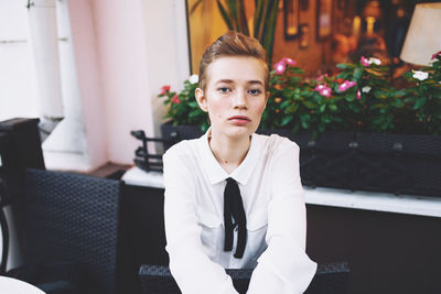 Portrait of young businesswoman standing in office