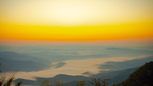 Scenic view of mountains against sky during sunset