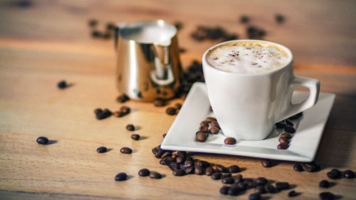 Close-up of coffee cup on table