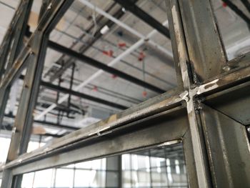 Low angle view of glass window of building