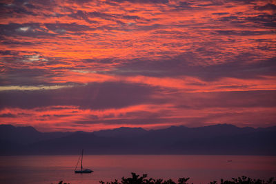 Scenic view of sea against orange sky