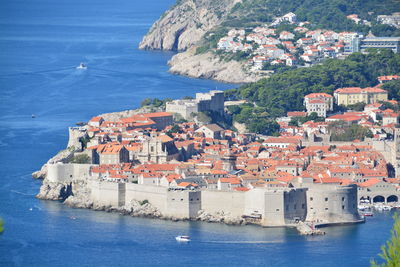 High angle view of town by sea