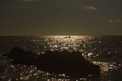 Scenic view of sea against sky at sunset