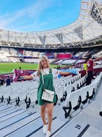 Rear view of people walking on street