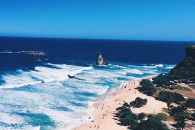 Scenic view of sea against clear blue sky