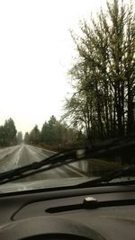 Road seen through car windshield