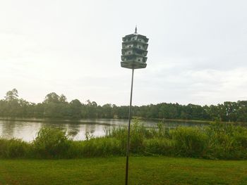 Scenic view of field against cloudy sky