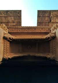 Low angle view of old building against sky