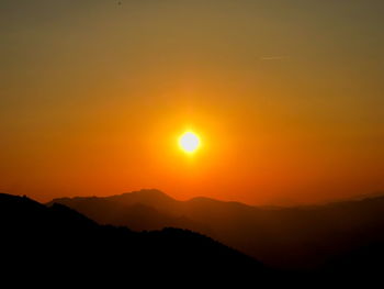 Scenic view of mountains at sunset