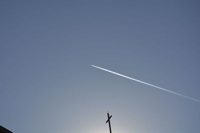 Low angle view of airplane flying in sky