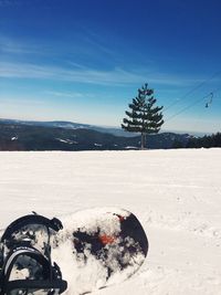 Scenic view of landscape against blue sky during winter