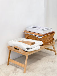 Empty chairs and table against wall at home