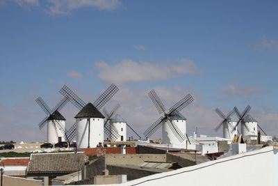 Traditional windmill against sky