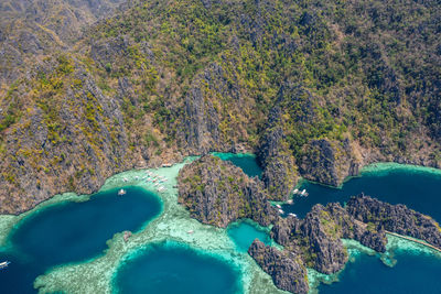 High angle view of rocks on sea shore